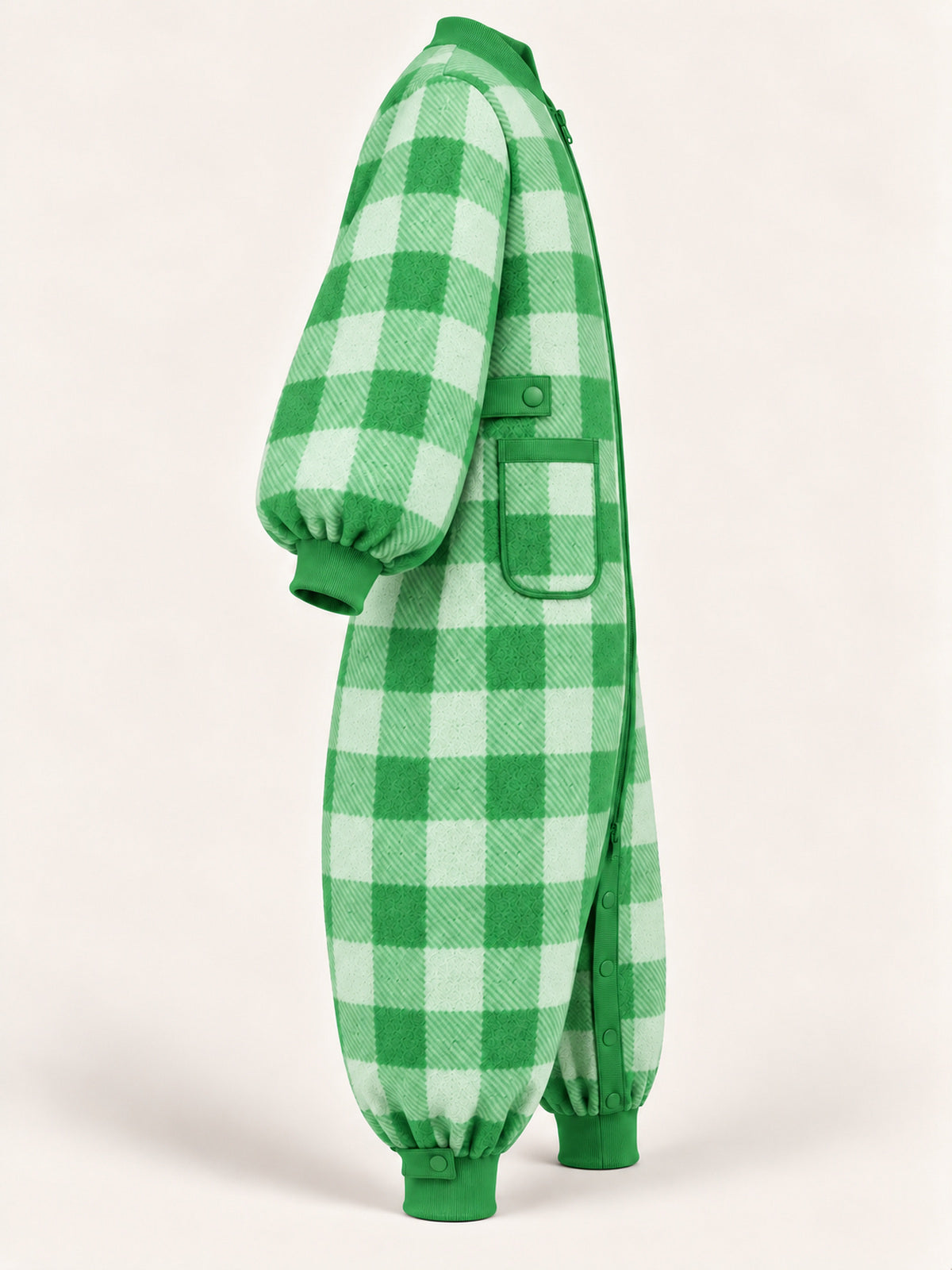 Side view of the green gingham adult onesie with a patch pocket, ribbed cuffs and waist snap tab