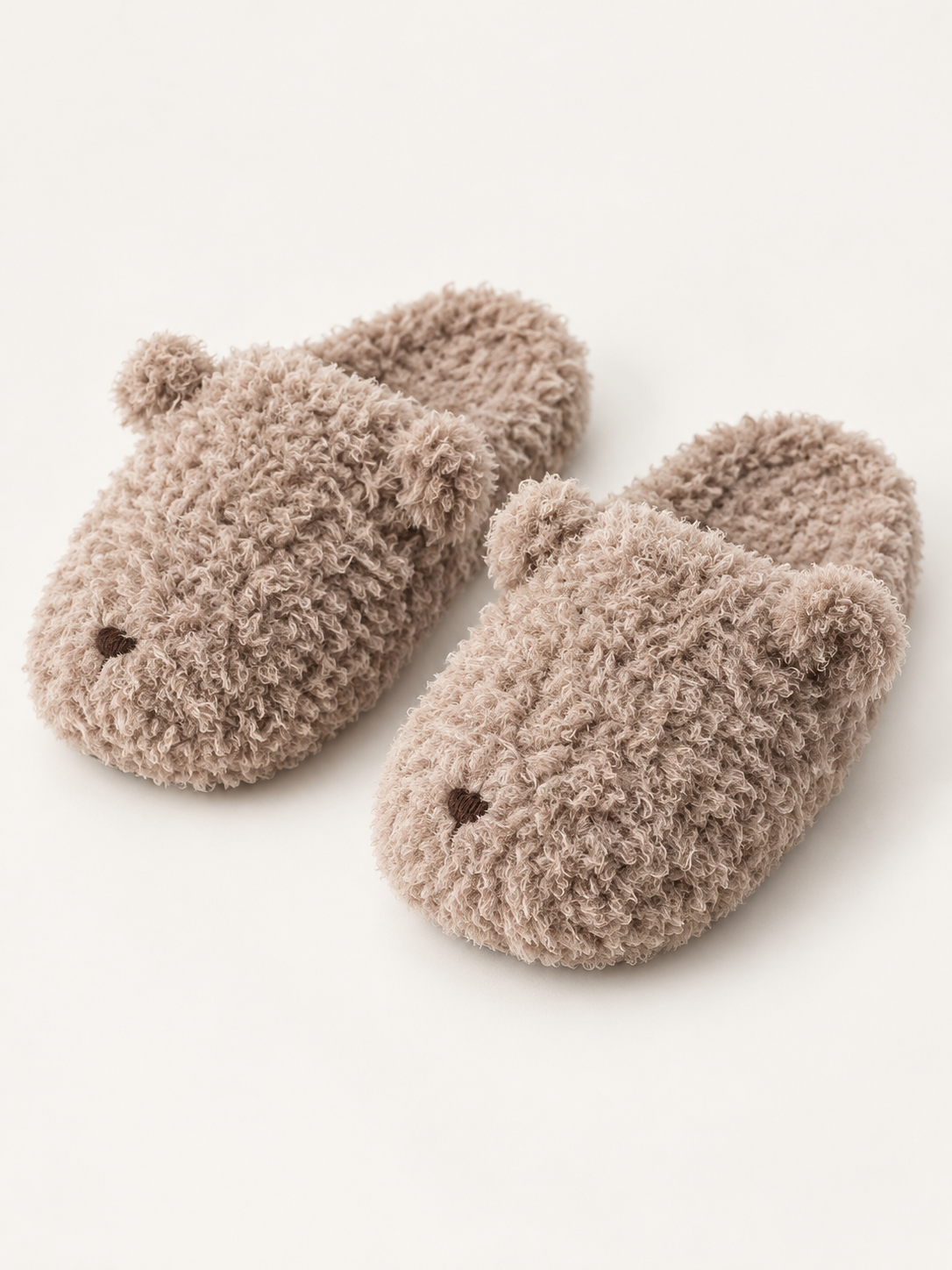 Taupe teddy bear house slippers with embroidered faces and curly plush texture