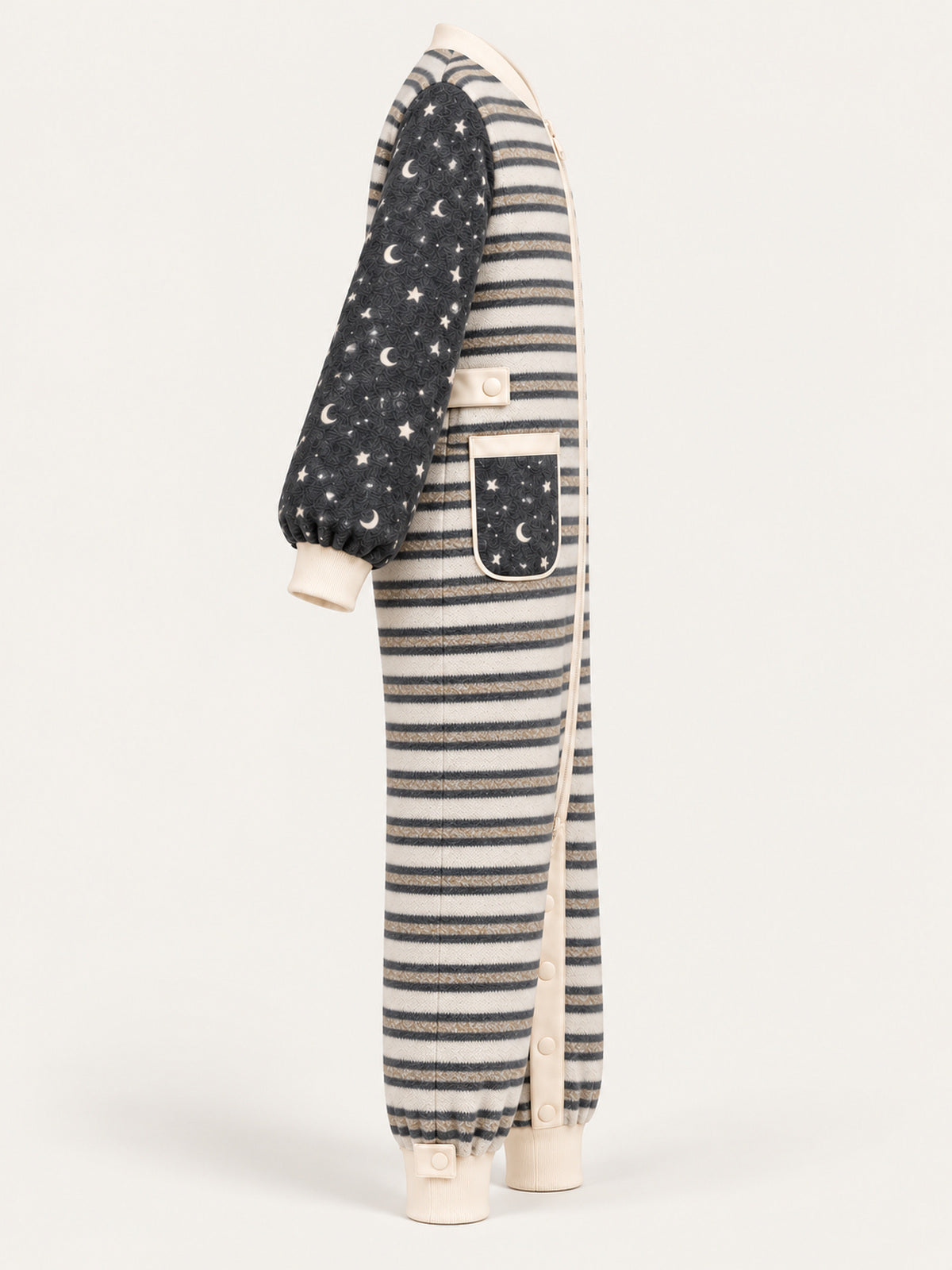 Side view of the striped adult onesie with star-and-moon sleeves and cream cuffs