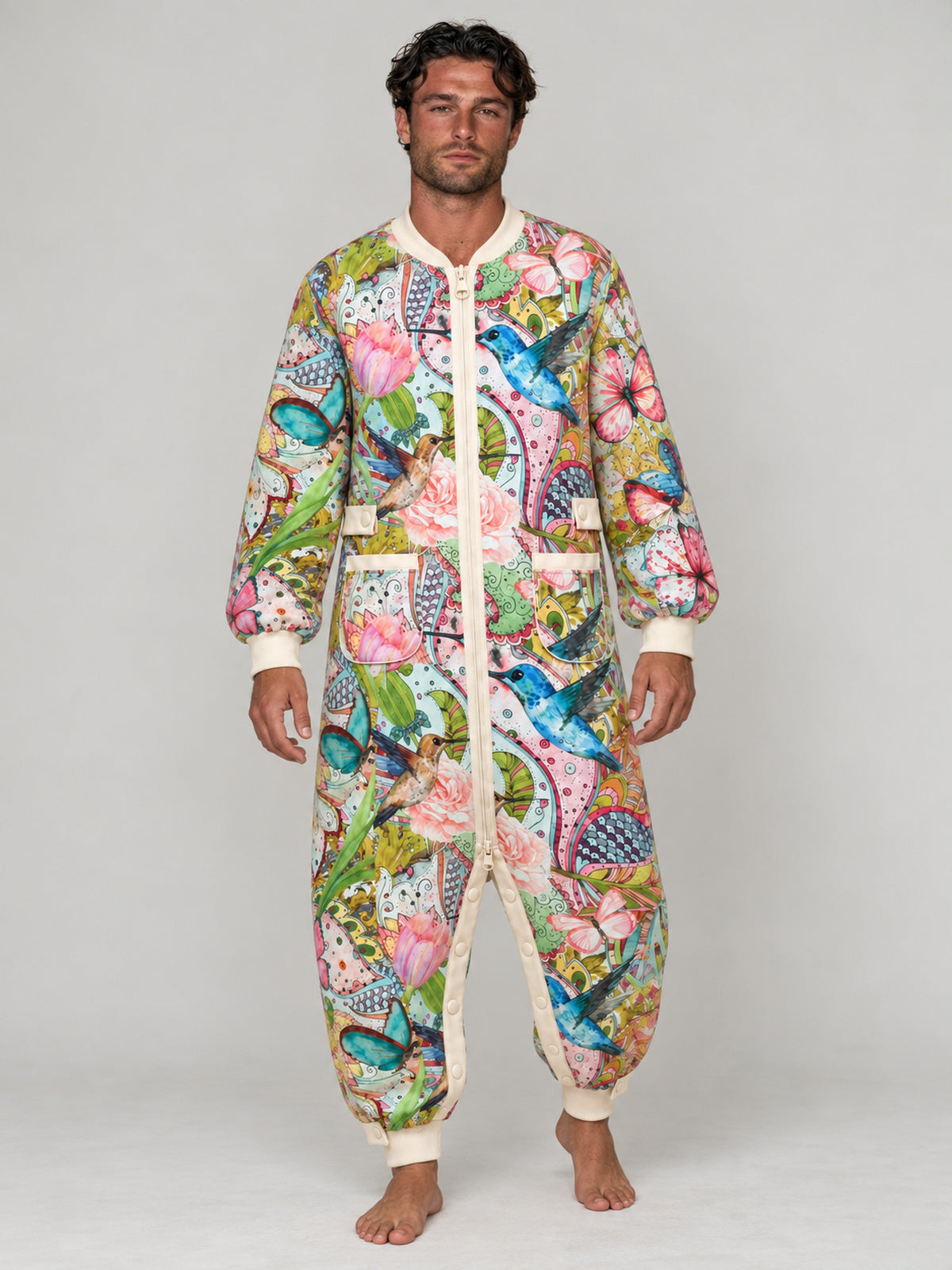 Adult model wearing the Hummingbird Garden matching floral onesie in a studio