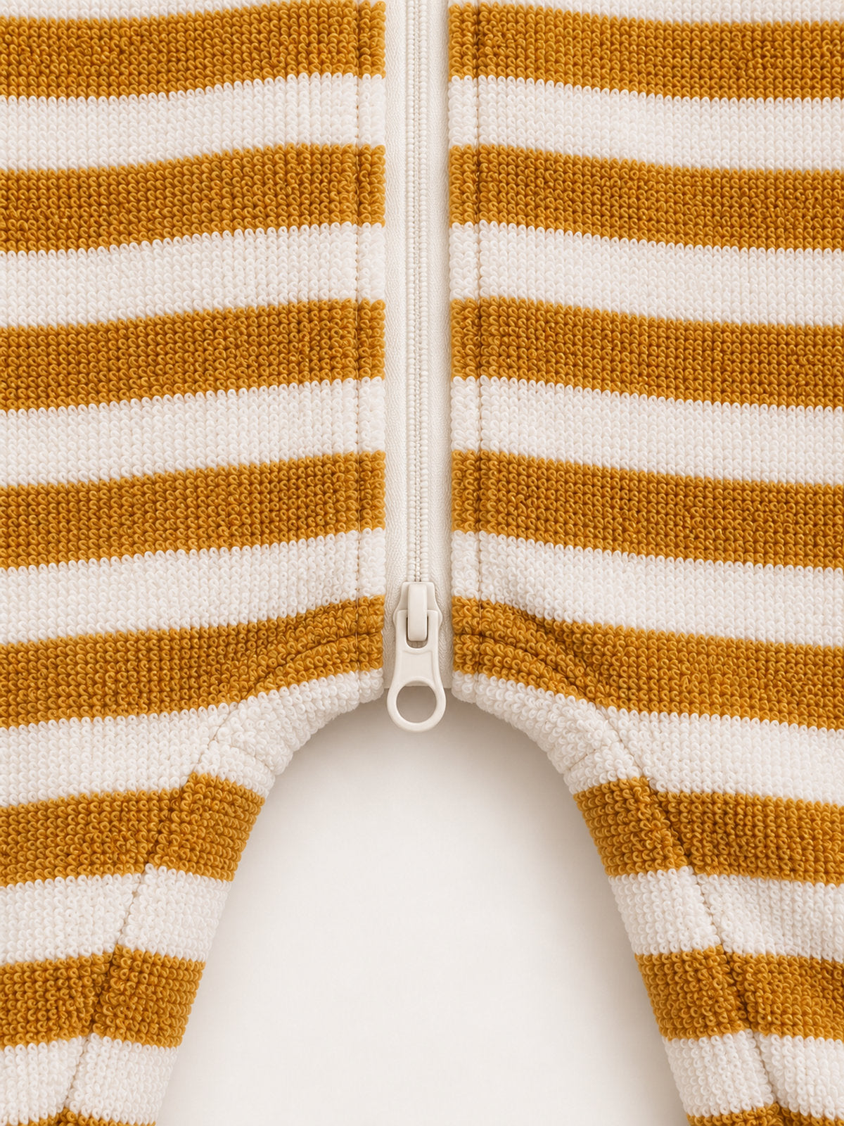Lower ring-pull zipper and dropped-crotch detail — Mustard Stripe Onesie