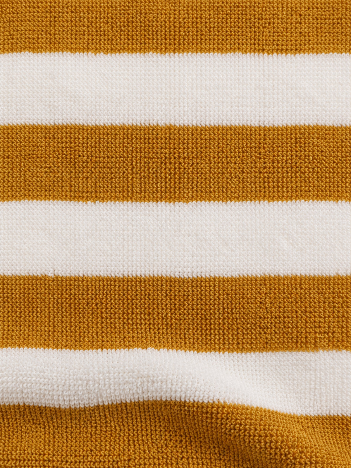 Close-up of the mustard and cream striped surface — Mustard Stripe Onesie